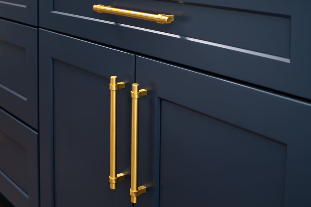 close-up on dark blue custom cabinets chicago with elegant golden handles close-up-on-dark-blue-custom-cabinets-chicago-with-elegant-golden-handles